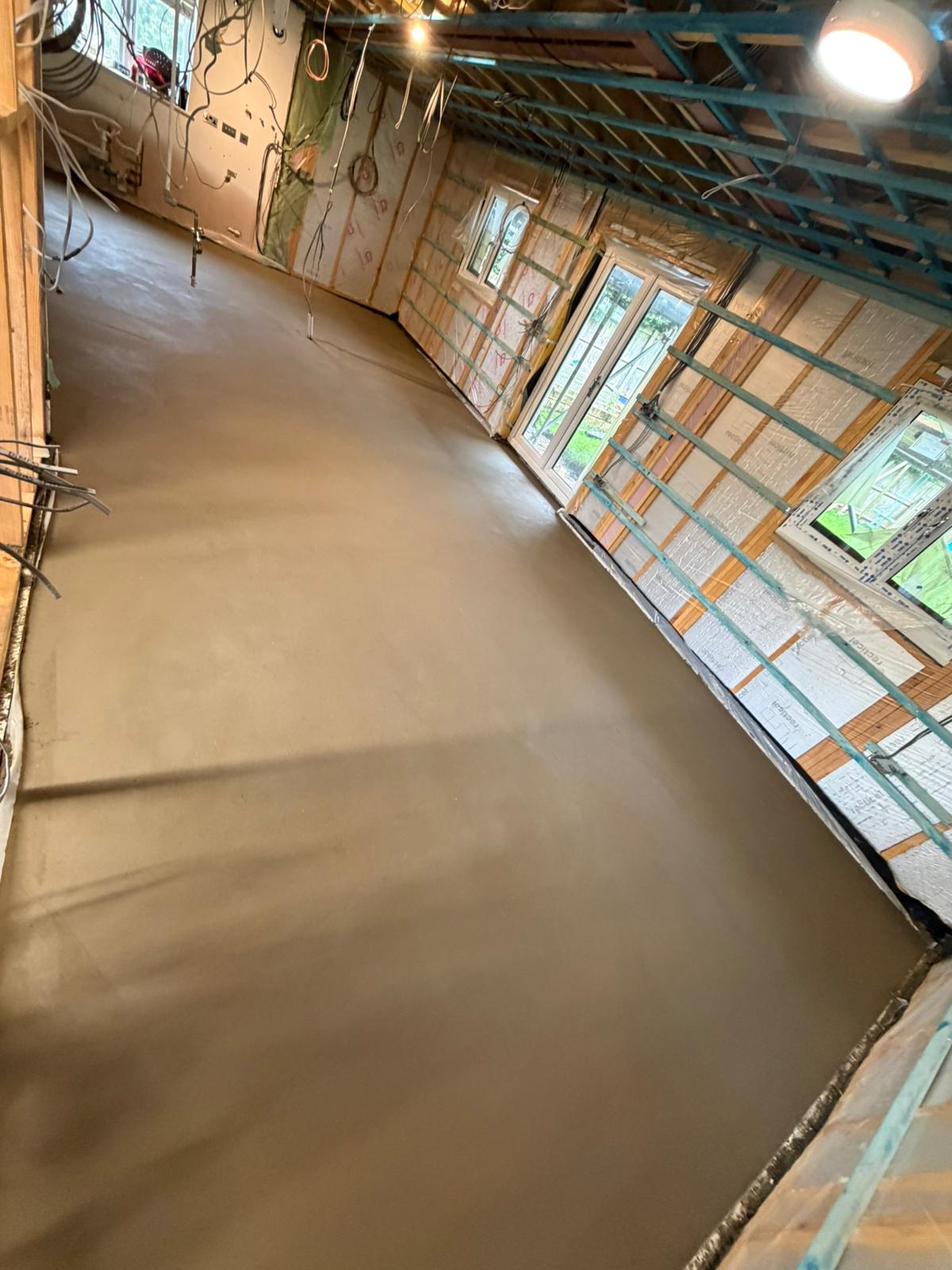 Finished screed brought up to the patio doors on the insulated wall