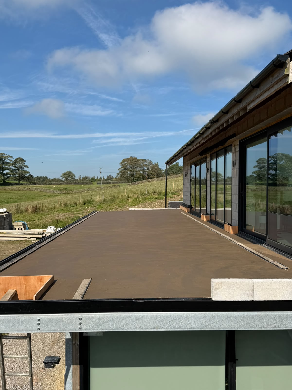 The screeded balcony seen from the end, running the length of the new build at Pott Shrigley