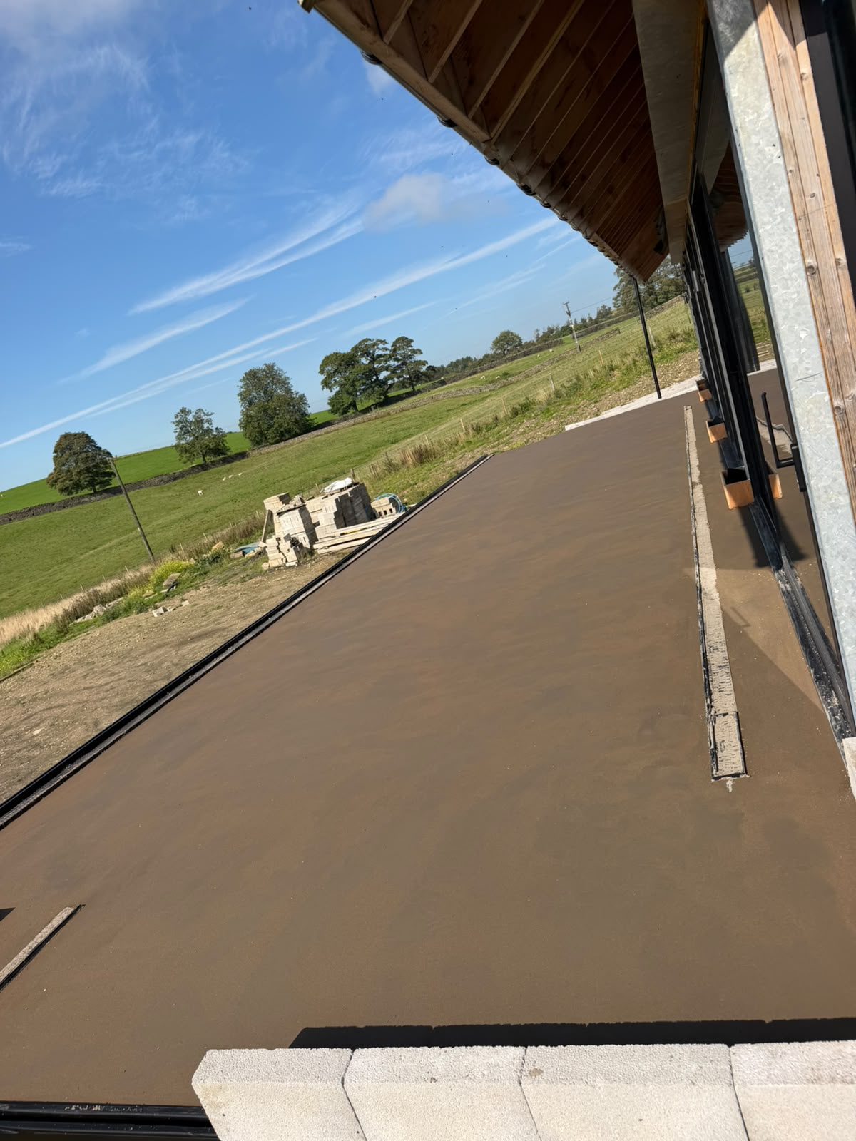 Finished Retanol screed on the external balcony at Pott Shrigley, laid to falls towards the edge