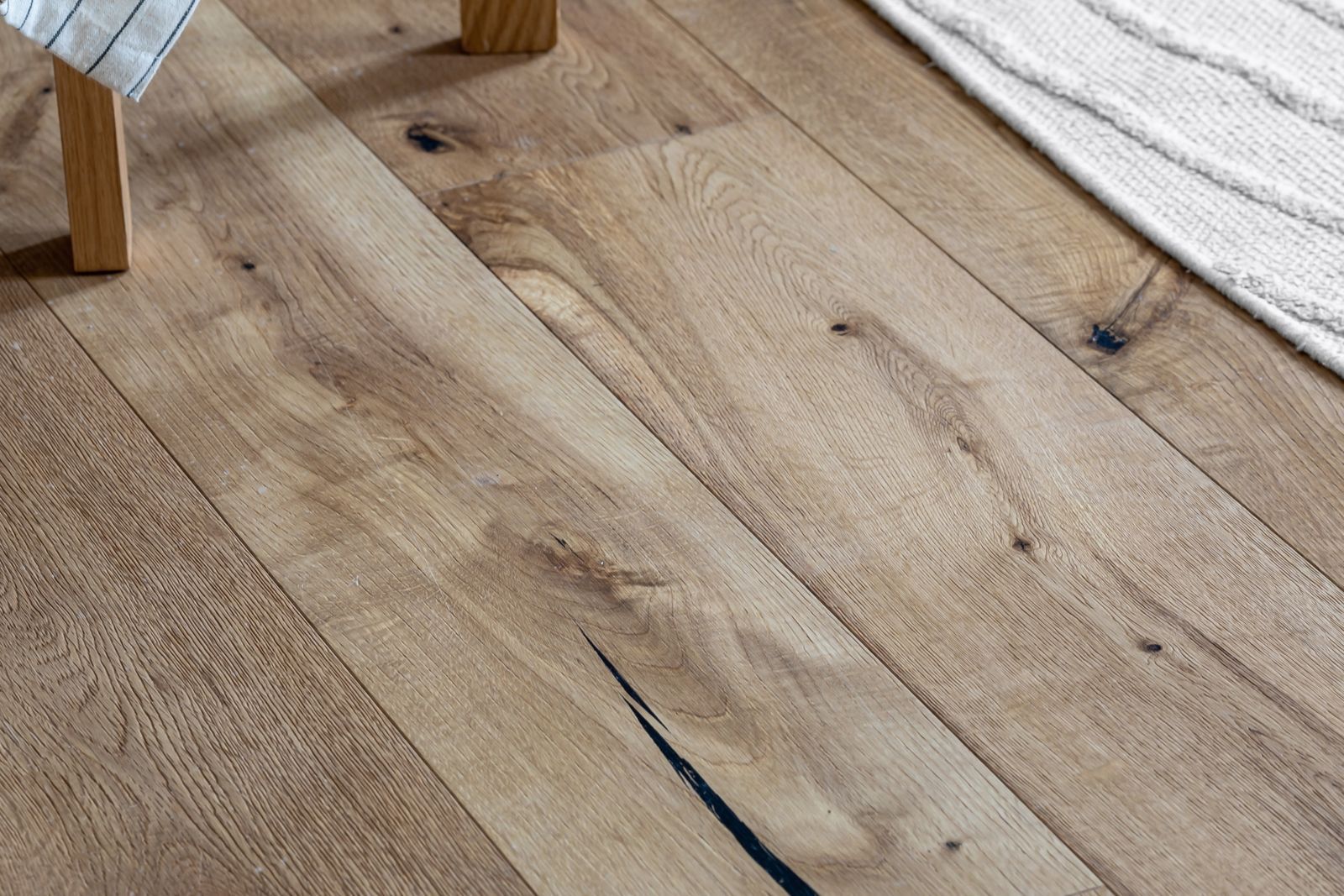 Finished plank flooring fitted in a living space
